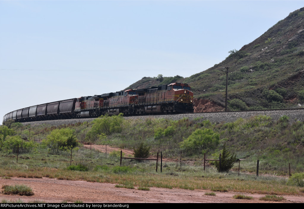 BNSF 5052 brings a empty grain train down curtis hill